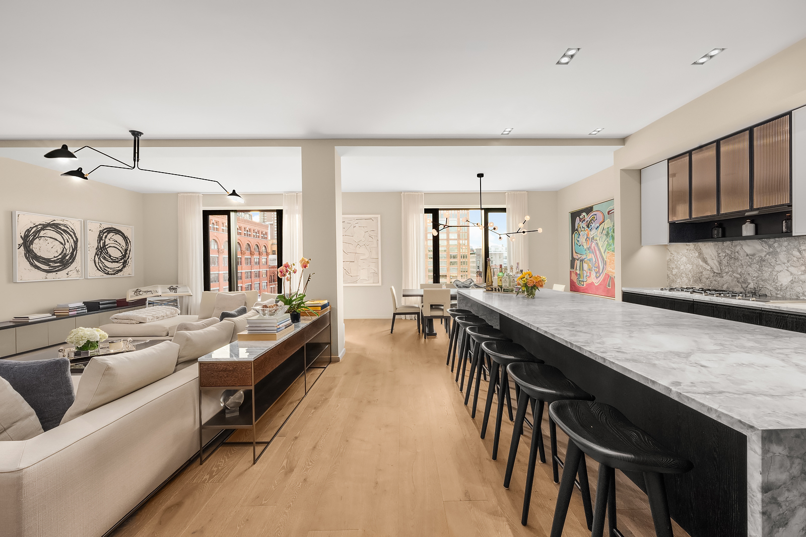 11 Beach Street, Unit 8A Manhattan, NY 10013 - Photo 5 of 23 a large living room with stainless steel appliances granite countertop a couch and a view of kitchen