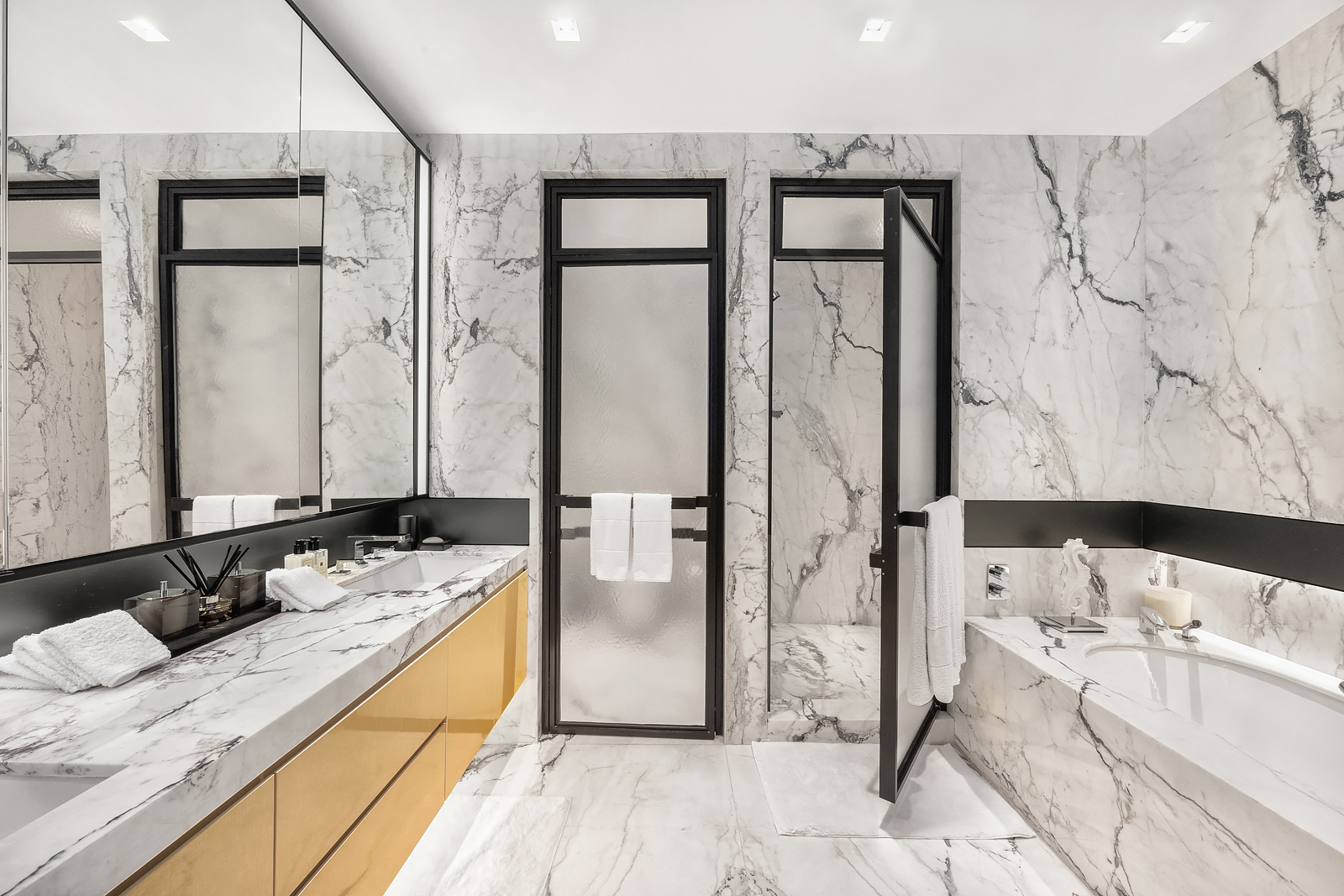 11 Beach Street, Unit 8A Manhattan, NY 10013 - Photo 9 of 23 a bathroom with a tub sink and mirror