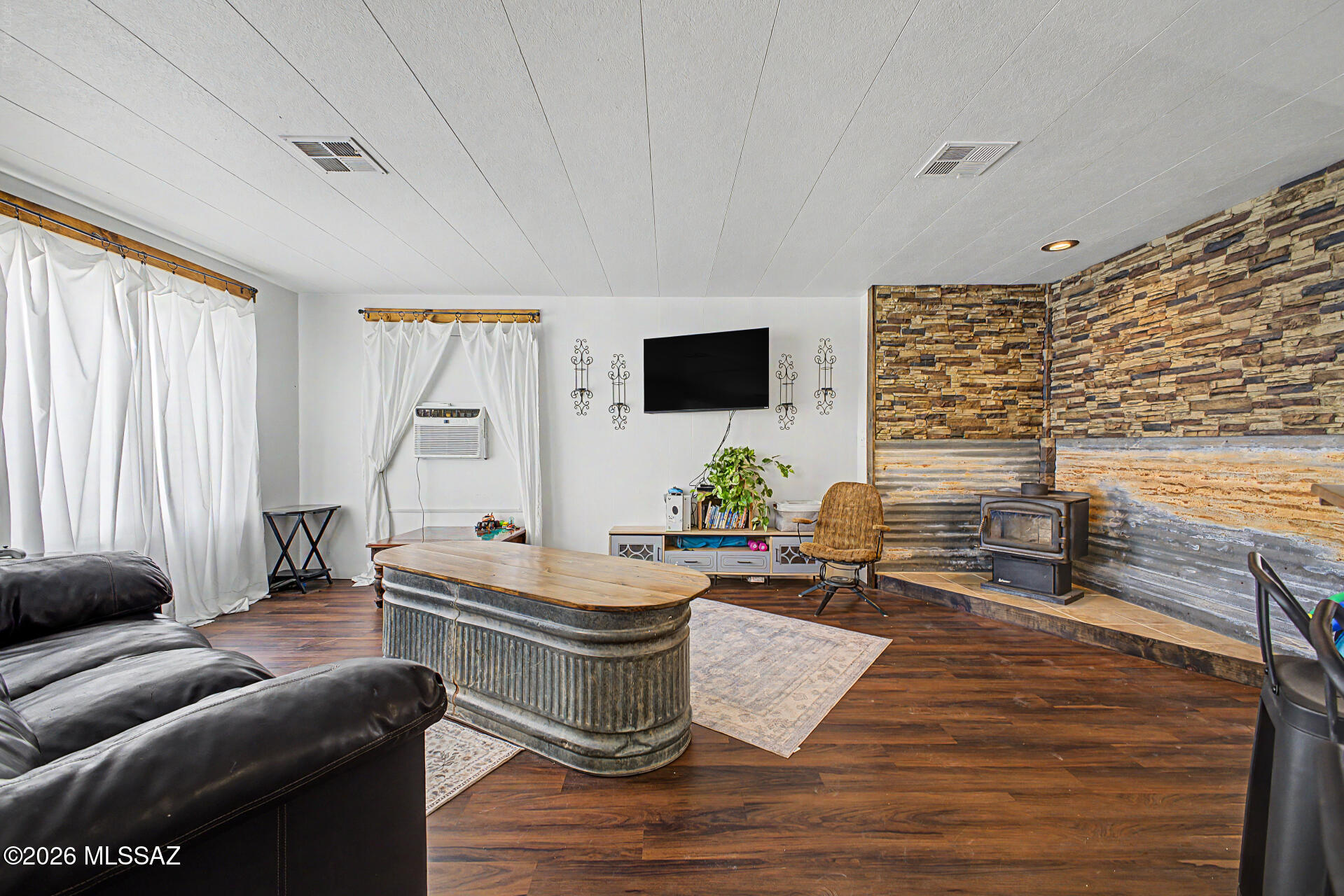 14721 East Colossal Cave Road Vail, AZ 85641 - Photo 35 of 50 Wood burning stove in living room area.
