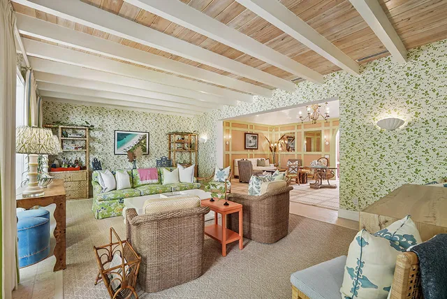 a outdoor living space with furniture and a chandelier