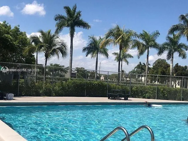 a view of a swimming pool and a garden