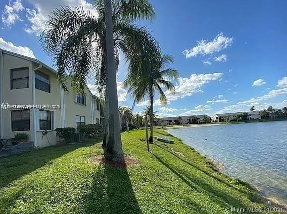 a view of a lake with a big yard