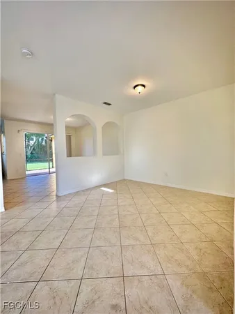 a view of an empty room and window