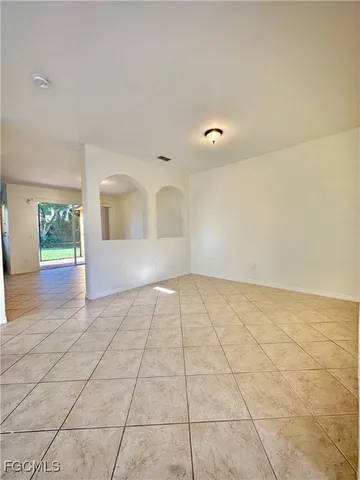 a view of an empty room and window