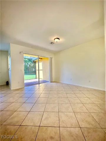 a view of an empty room and window