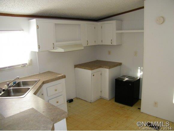 188 Worth Lane Rutherfordton, NC 28139 - Photo 8 of 14 a kitchen with a sink and cabinets