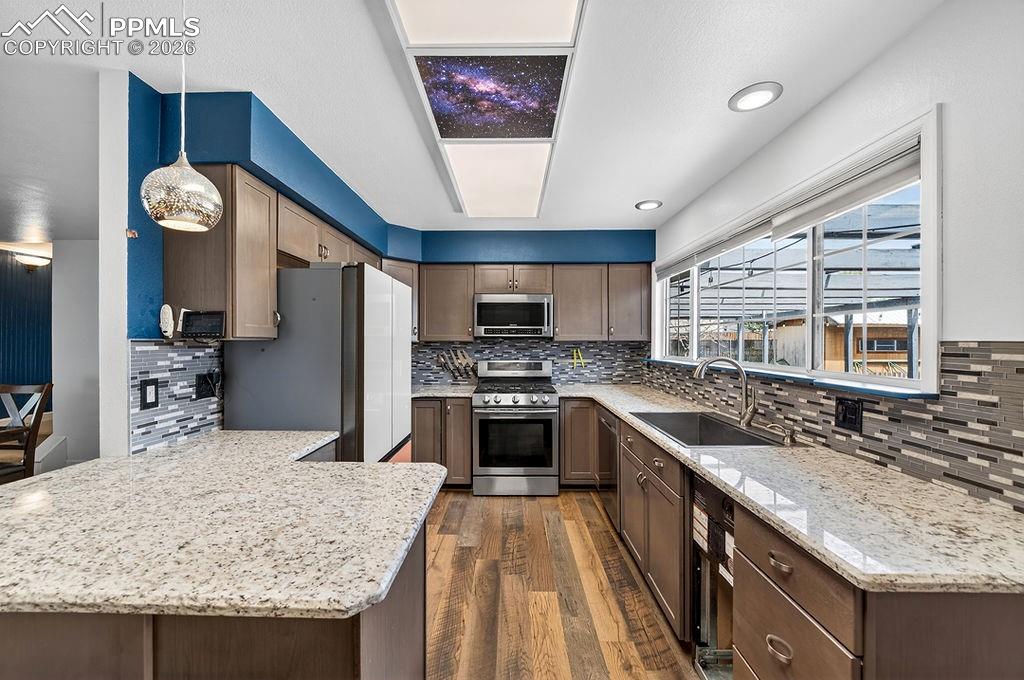 10905 Falling Star Road Fountain, CO 80817 - Photo 15 of 46 The new cabinets provide generous storage and add to the kitchen’s appeal.