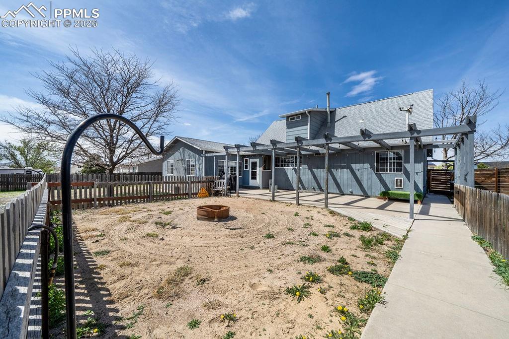 10905 Falling Star Road Fountain, CO 80817 - Photo 35 of 46 Fire pit area, (once an area for an above ground swimming pool).