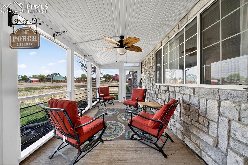 10905 Falling Star Road Fountain, CO 80817 - Photo 5 of 46 Screened in front porch with concrete floor.