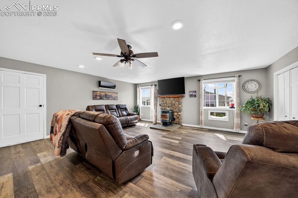 10905 Falling Star Road Fountain, CO 80817 - Photo 7 of 46 Living room windows updated with a built-in pet window.
