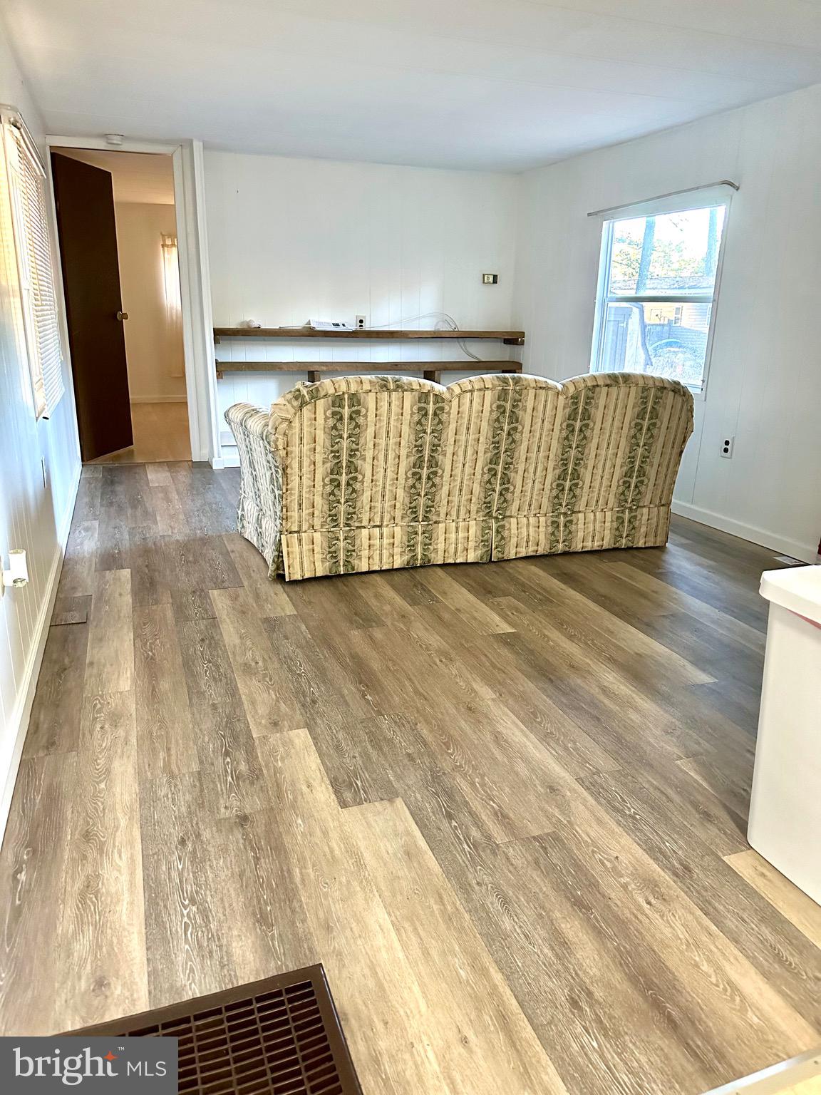 27284 Cottage Road Millsboro, DE 19966 - Photo 4 of 8 a view of a room with wooden floor