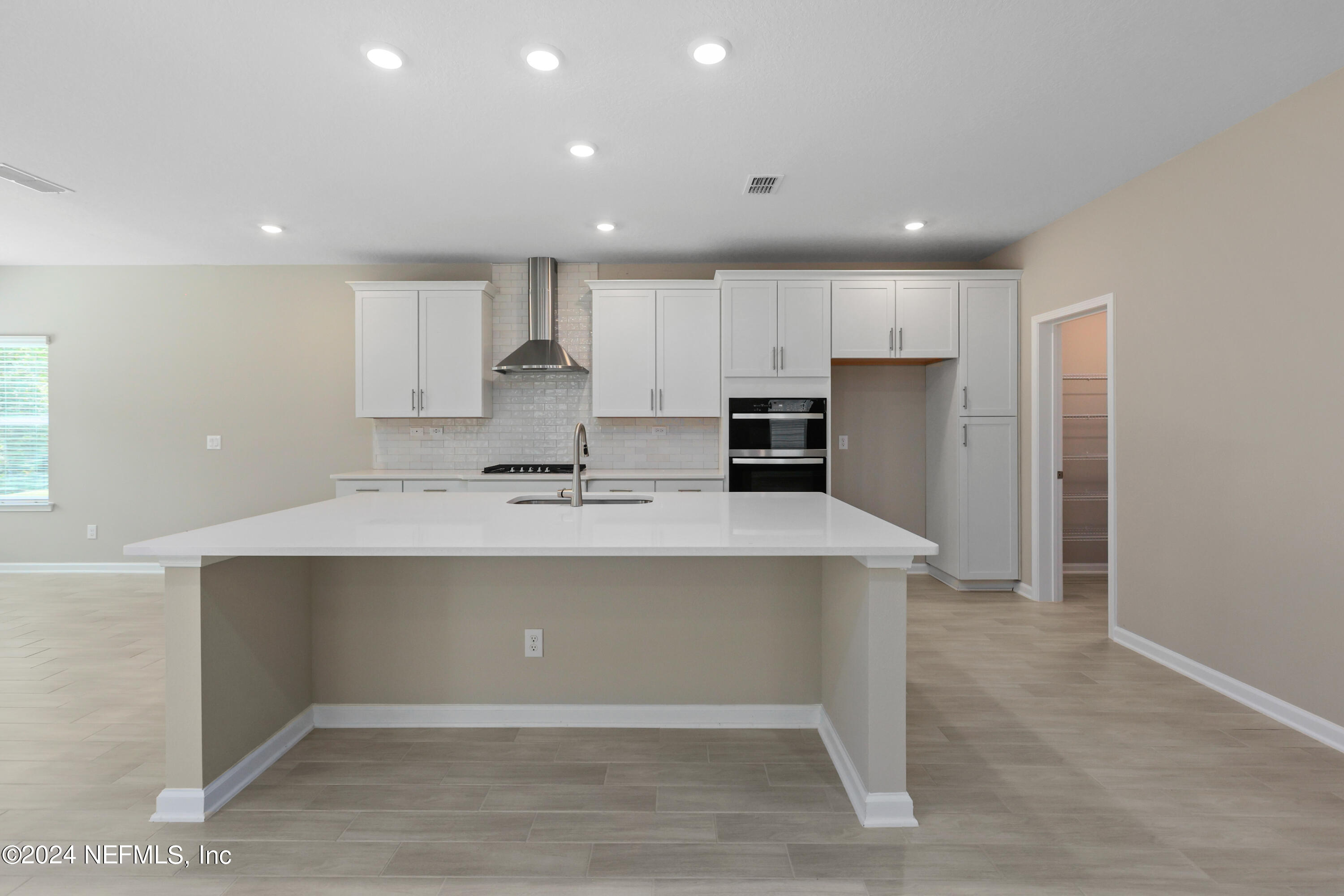 75605 Blackbird Drive Yulee, FL 32097 - Photo 10 of 46 a view of kitchen with stainless steel appliances sink refrigerator and microwave