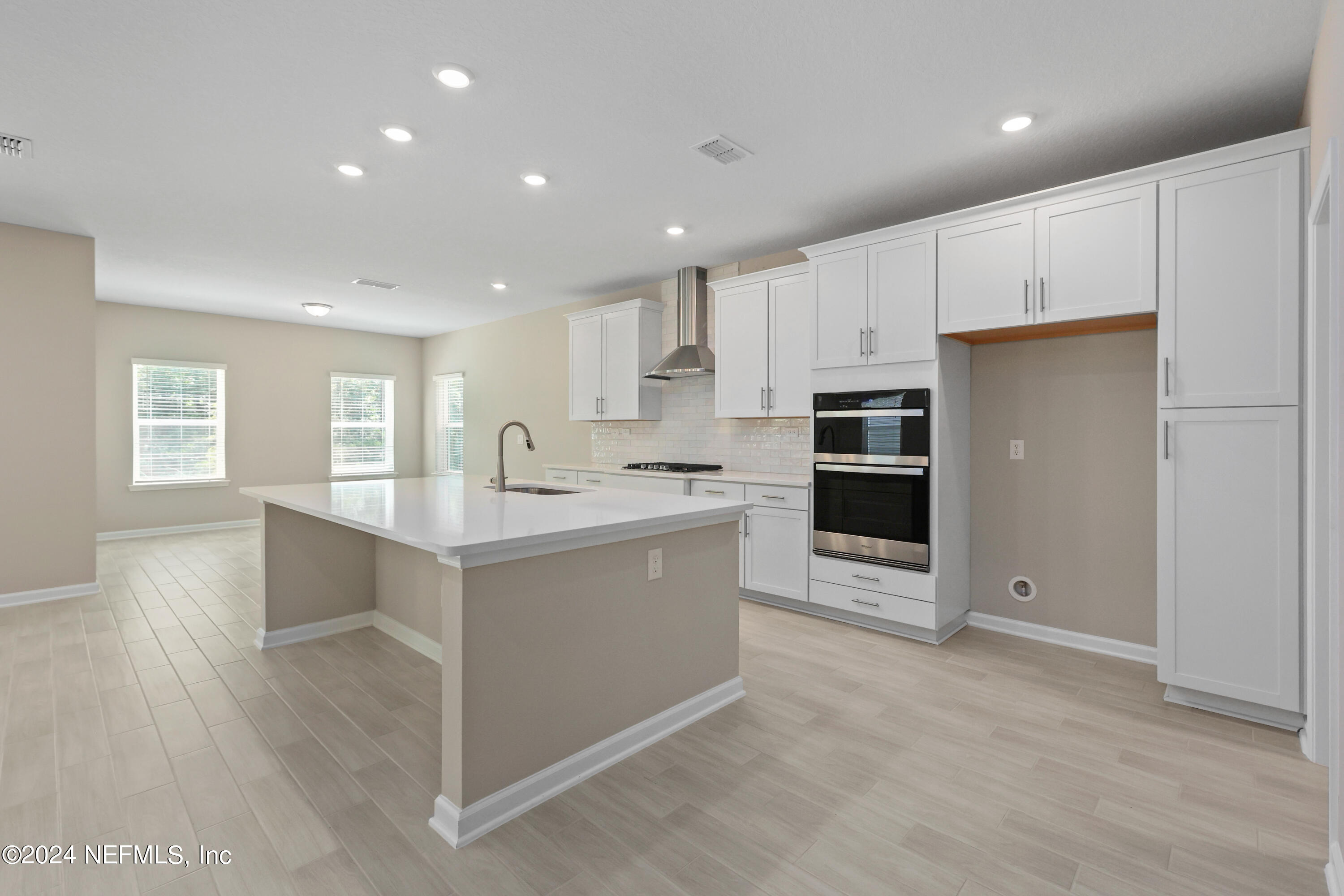 75605 Blackbird Drive Yulee, FL 32097 - Photo 13 of 46 a kitchen with stainless steel appliances a refrigerator sink and cabinets