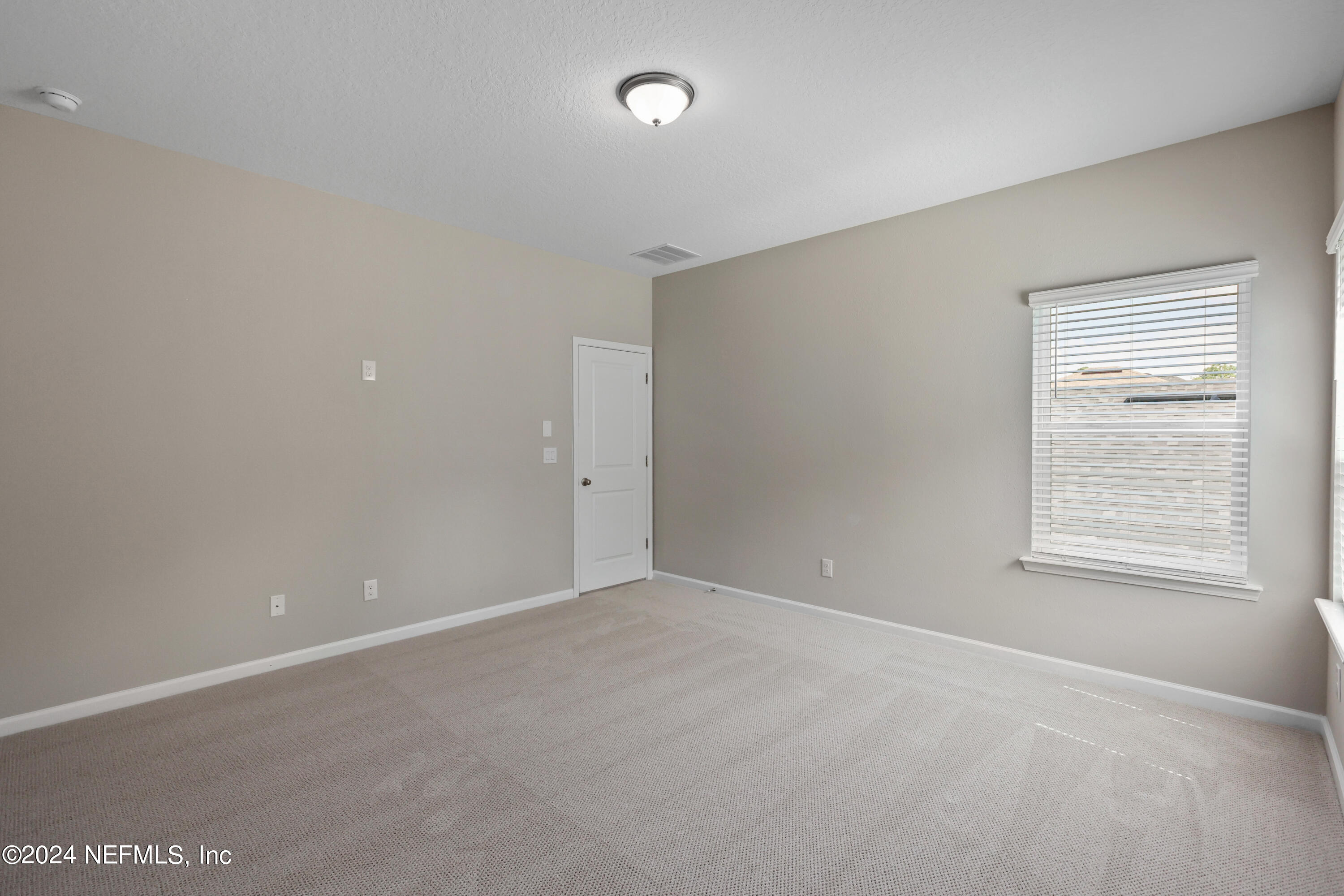 75605 Blackbird Drive Yulee, FL 32097 - Photo 19 of 46 an empty room with a window