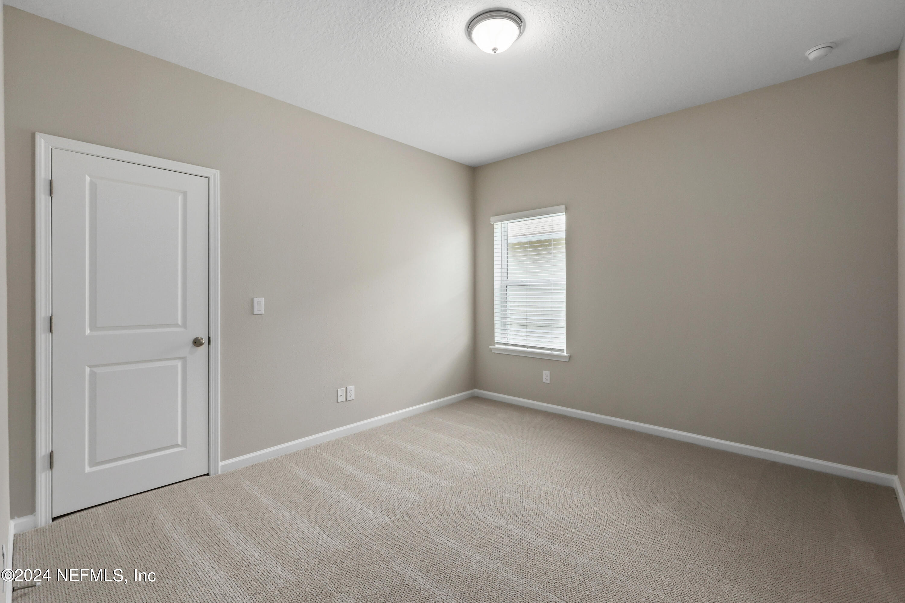 75605 Blackbird Drive Yulee, FL 32097 - Photo 24 of 46 an empty room with windows