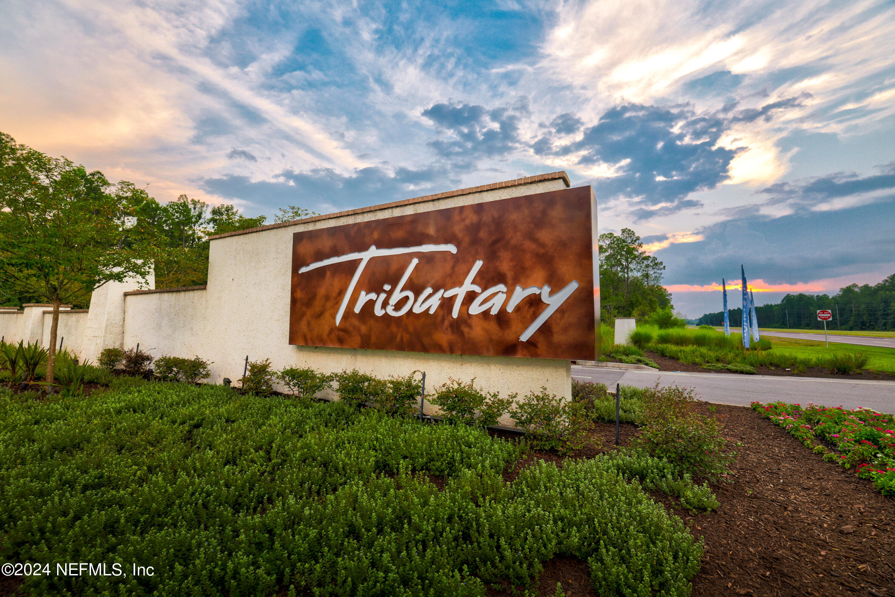 75605 Blackbird Drive Yulee, FL 32097 - Photo 35 of 46 a sign of golf club on a wall under a tree