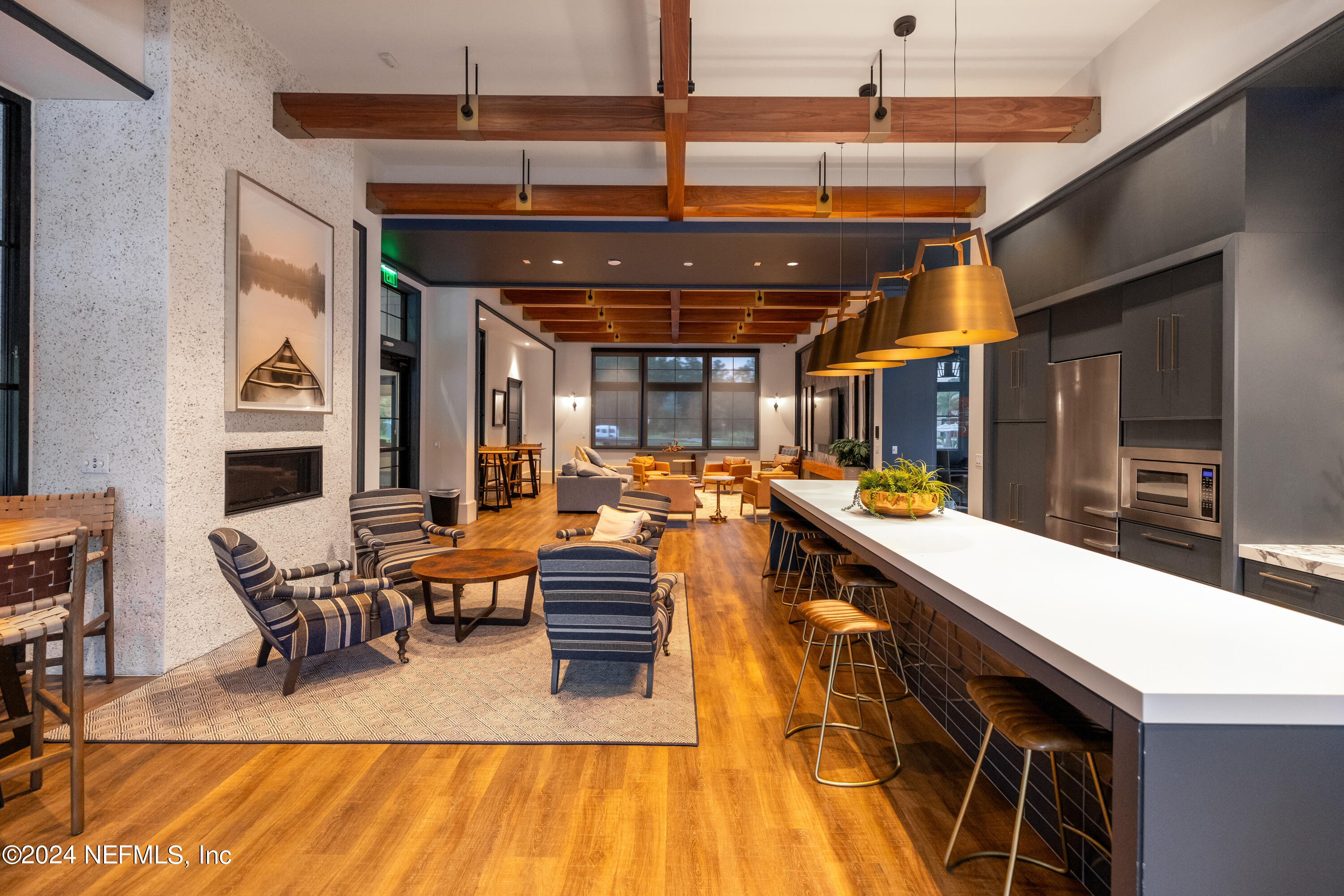 75605 Blackbird Drive Yulee, FL 32097 - Photo 45 of 46 a room with lots of wooden furniture and a chandelier