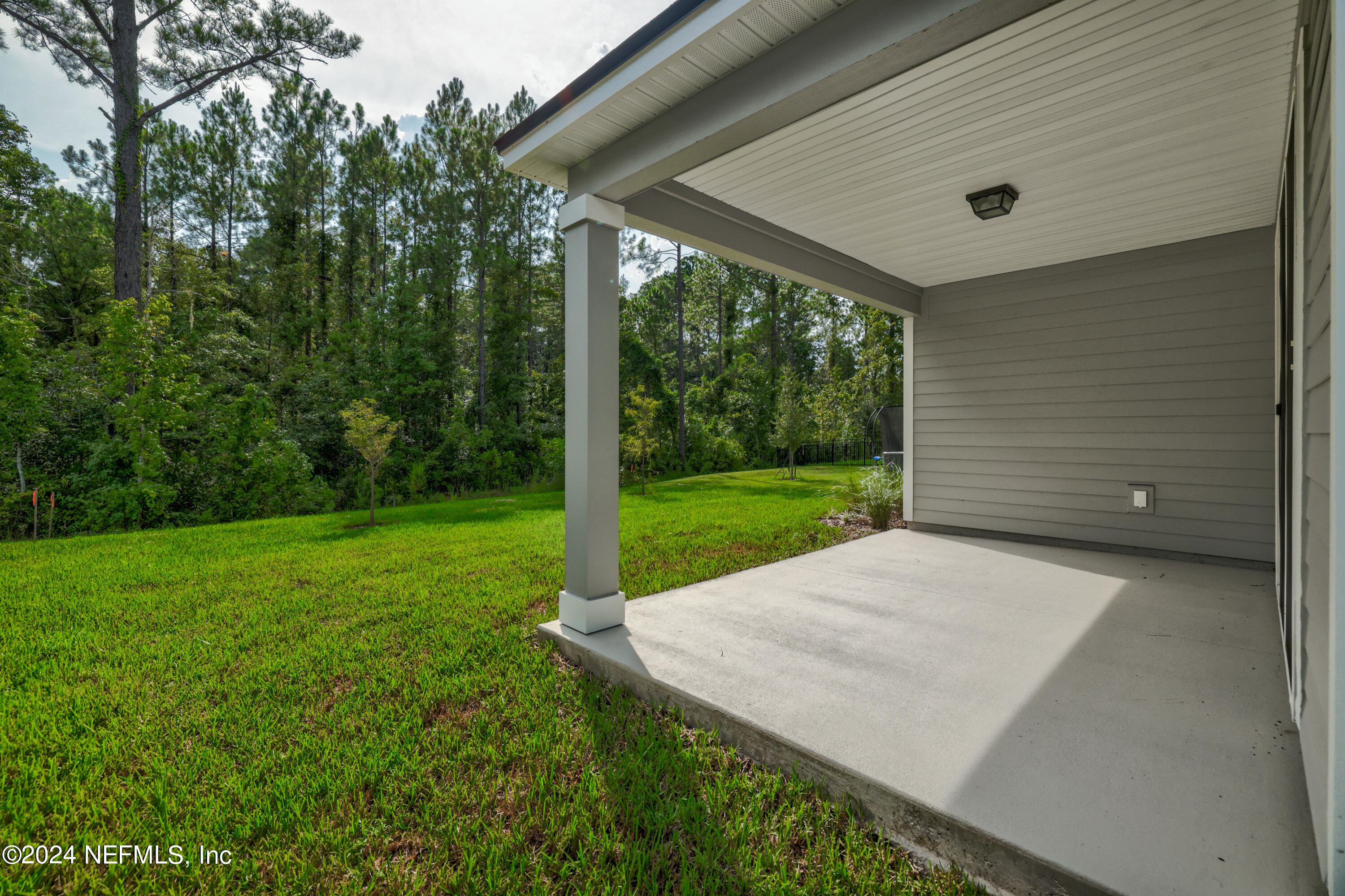 75605 Blackbird Drive Yulee, FL 32097 - Photo 5 of 46 a view of a backyard with a garden