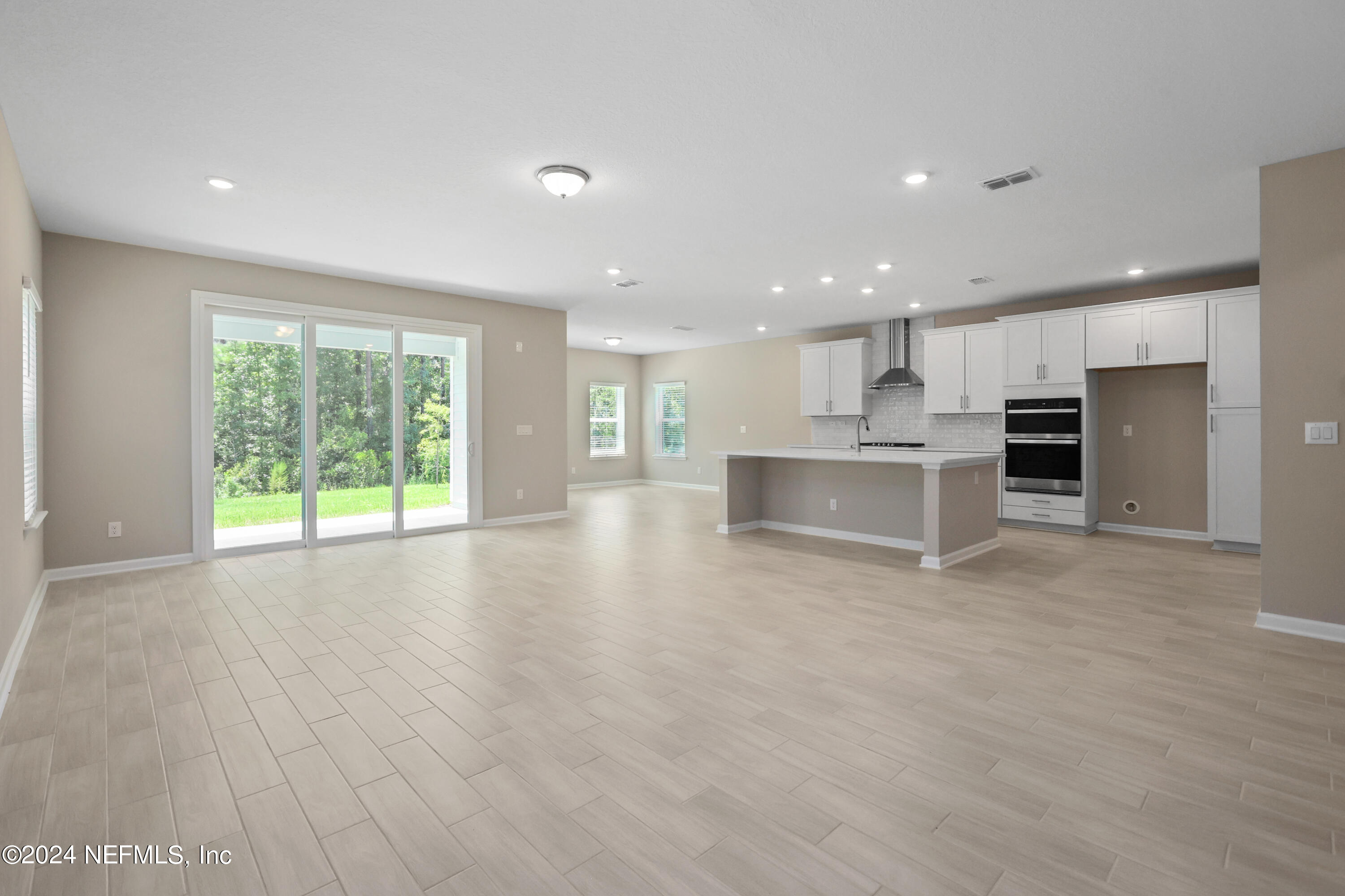 75605 Blackbird Drive Yulee, FL 32097 - Photo 46 of 46 a view of kitchen with wooden floor and a window