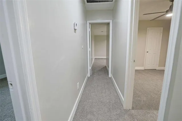 a bathroom with a sink toilet and a mirror