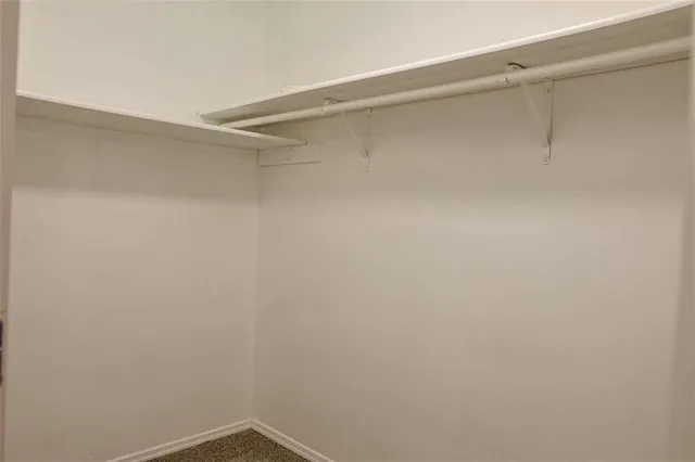 a bathroom with double sink and a mirror