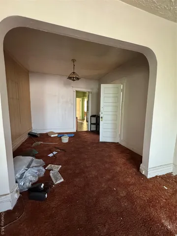 a room with a bed and a window