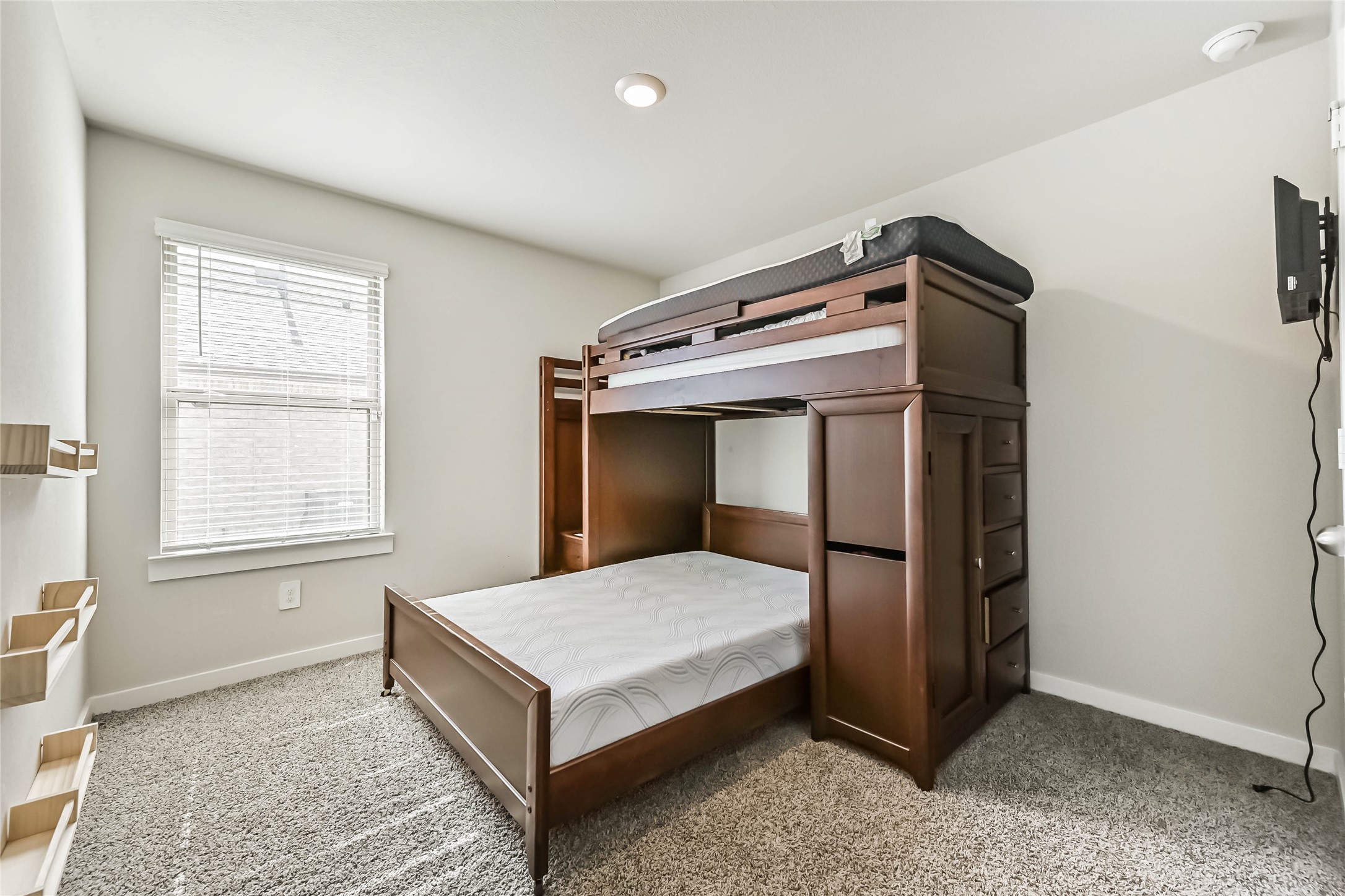 136 Little Spg Court Anahuac, TX 77514 - Photo 18 of 34 a bedroom with a bed and a window