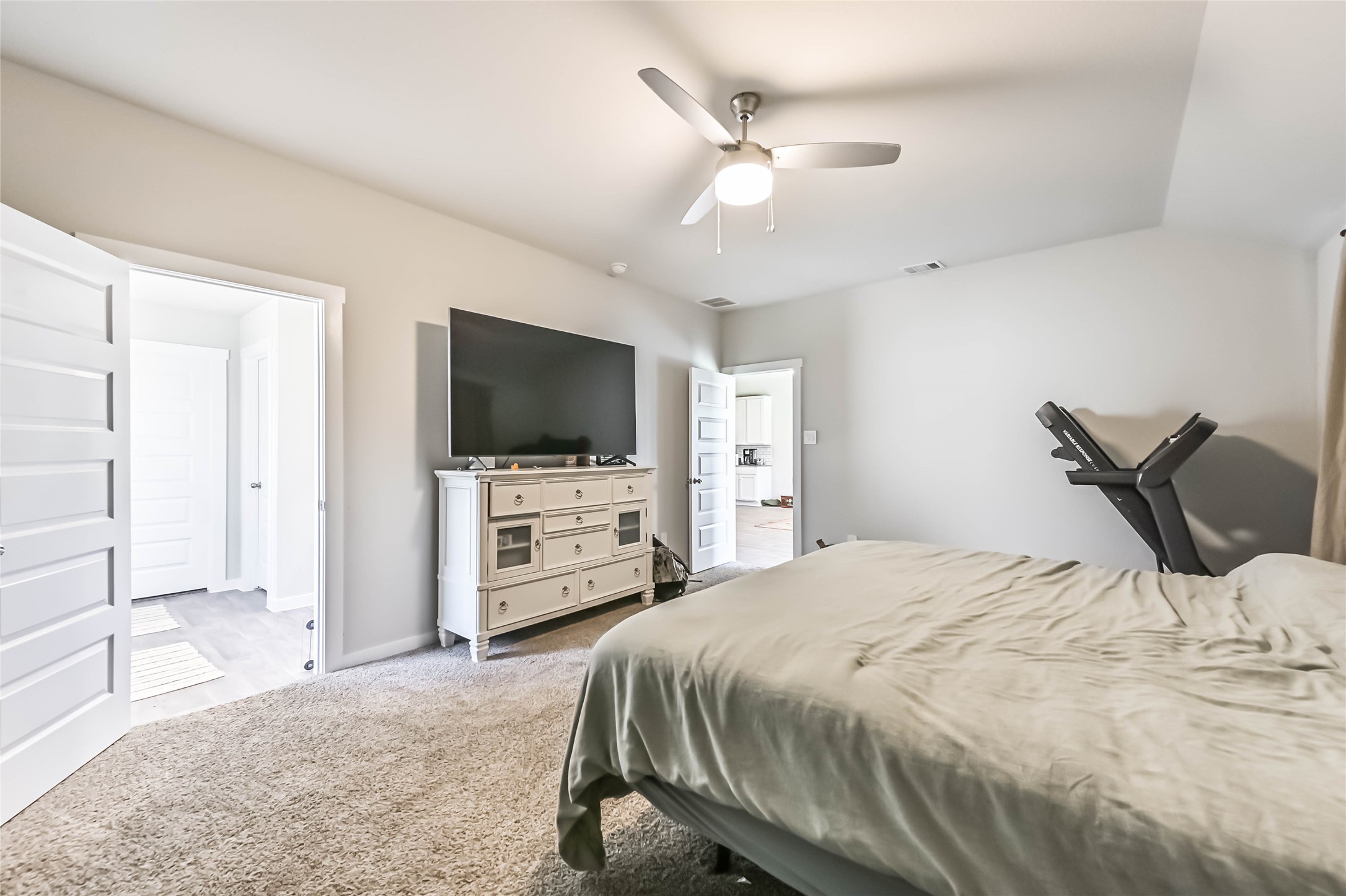 136 Little Spg Court Anahuac, TX 77514 - Photo 22 of 34 a bedroom with a bed and a flat screen tv