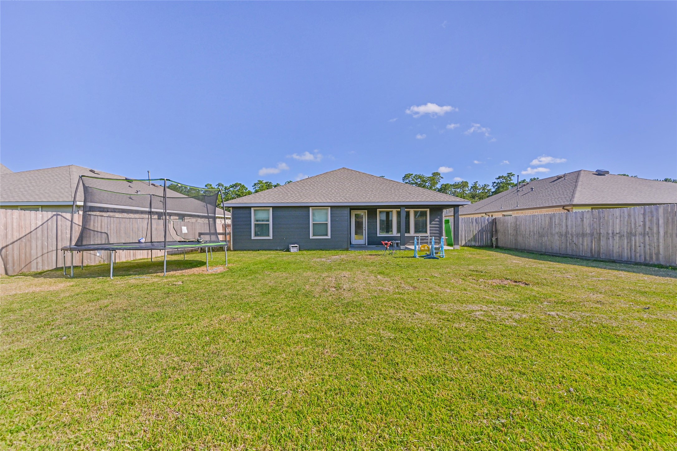 136 Little Spg Court Anahuac, TX 77514 - Photo 28 of 34 a front view of a house with a swimming pool
