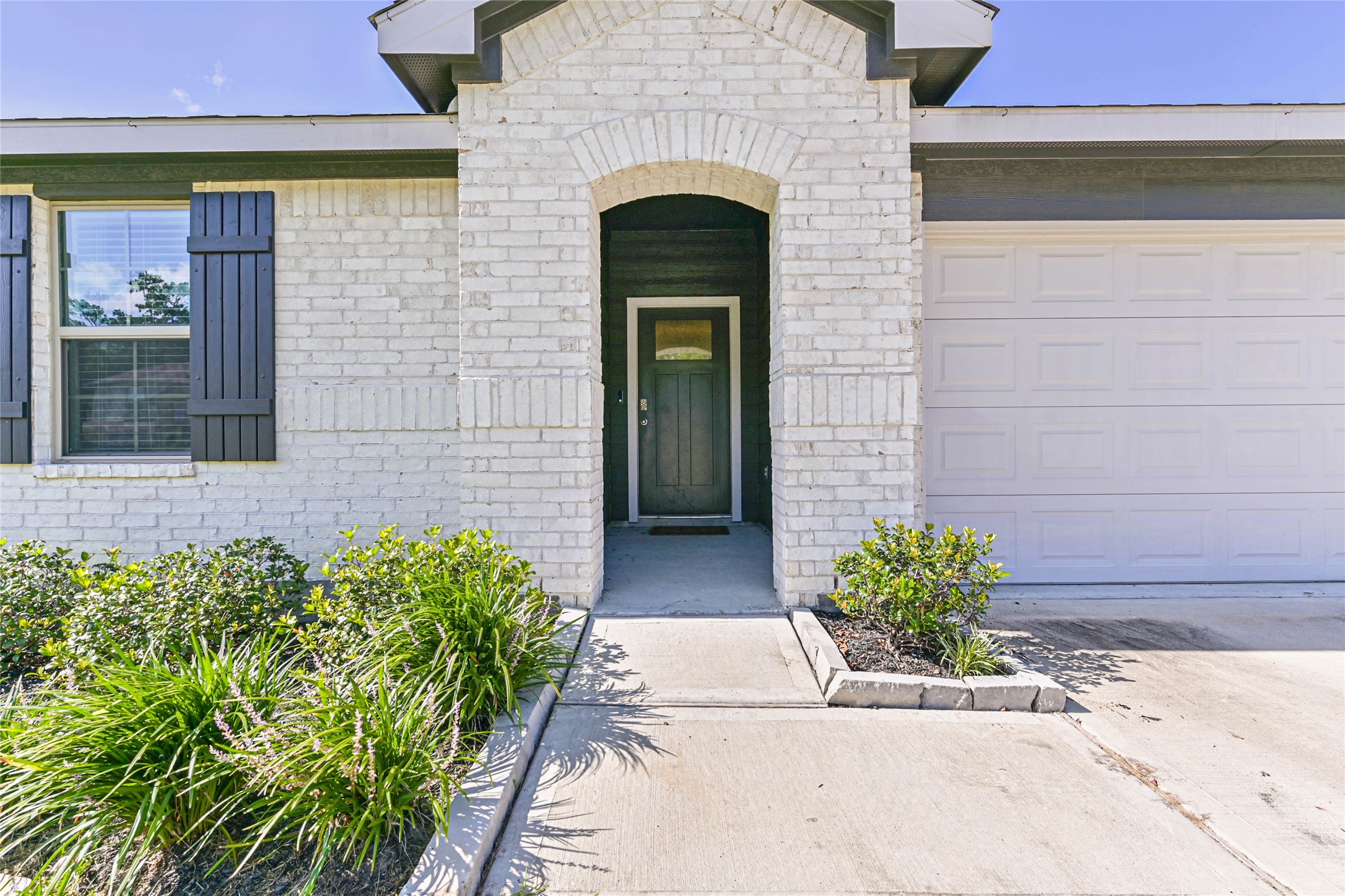136 Little Spg Court Anahuac, TX 77514 - Photo 31 of 34 a front view of a house with a garden