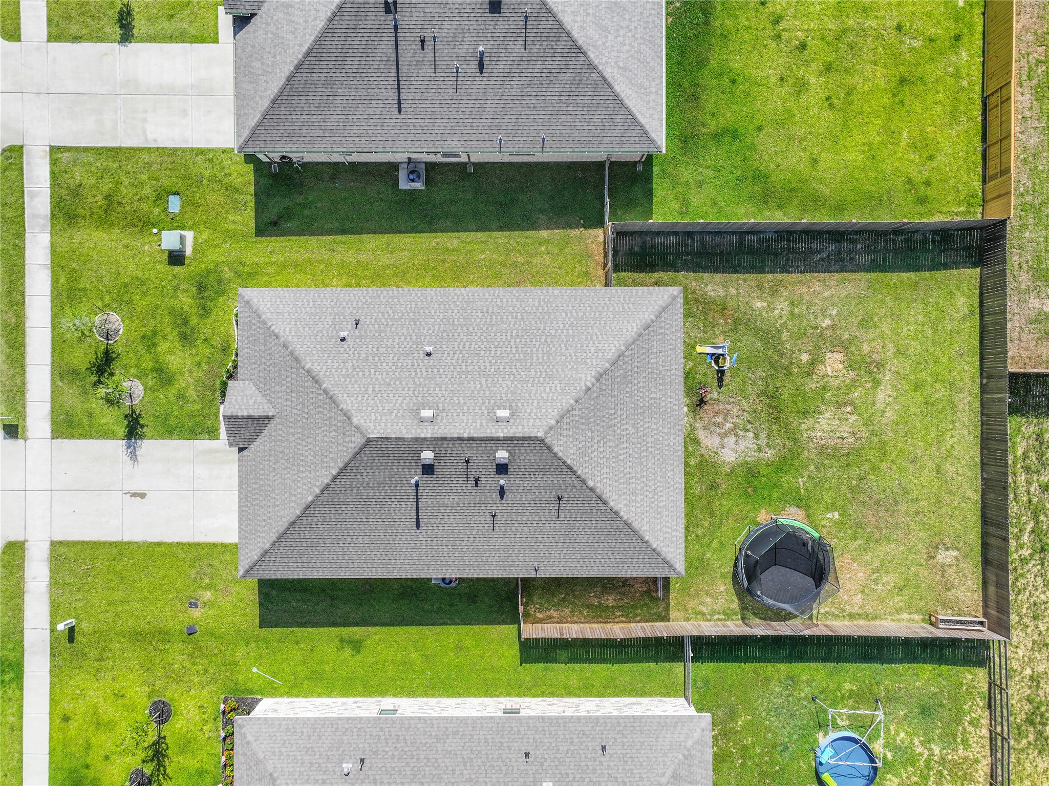 136 Little Spg Court Anahuac, TX 77514 - Photo 33 of 34 an aerial view of a house with a garden