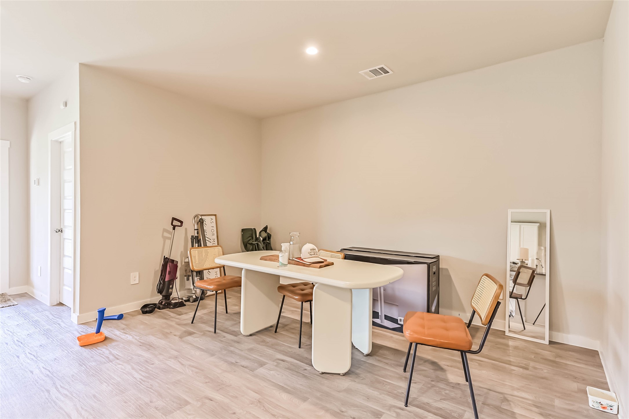 136 Little Spg Court Anahuac, TX 77514 - Photo 5 of 34 a view of a workspace with furniture and wooden floor