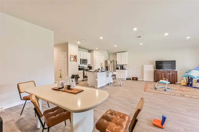 a view of a dining room with furniture