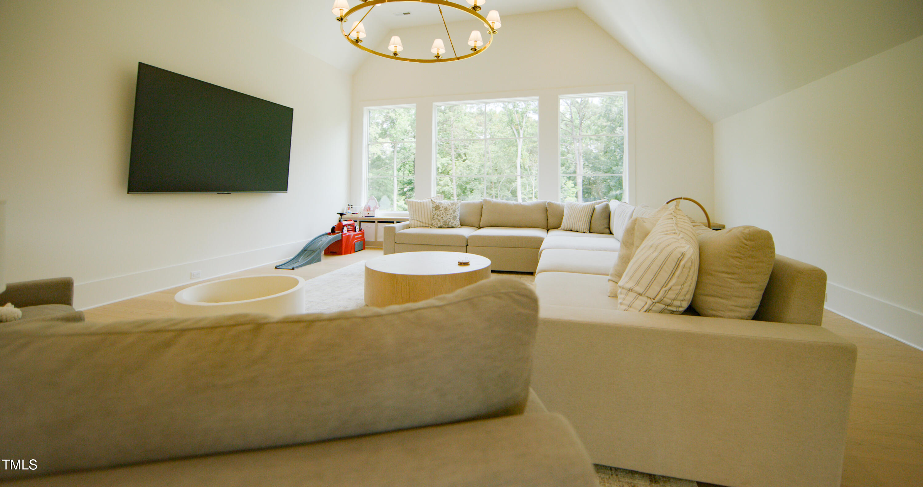 1620 Hunting Ridge Road Raleigh, NC 27615 - Photo 14 of 24 a living room with furniture and a flat screen tv