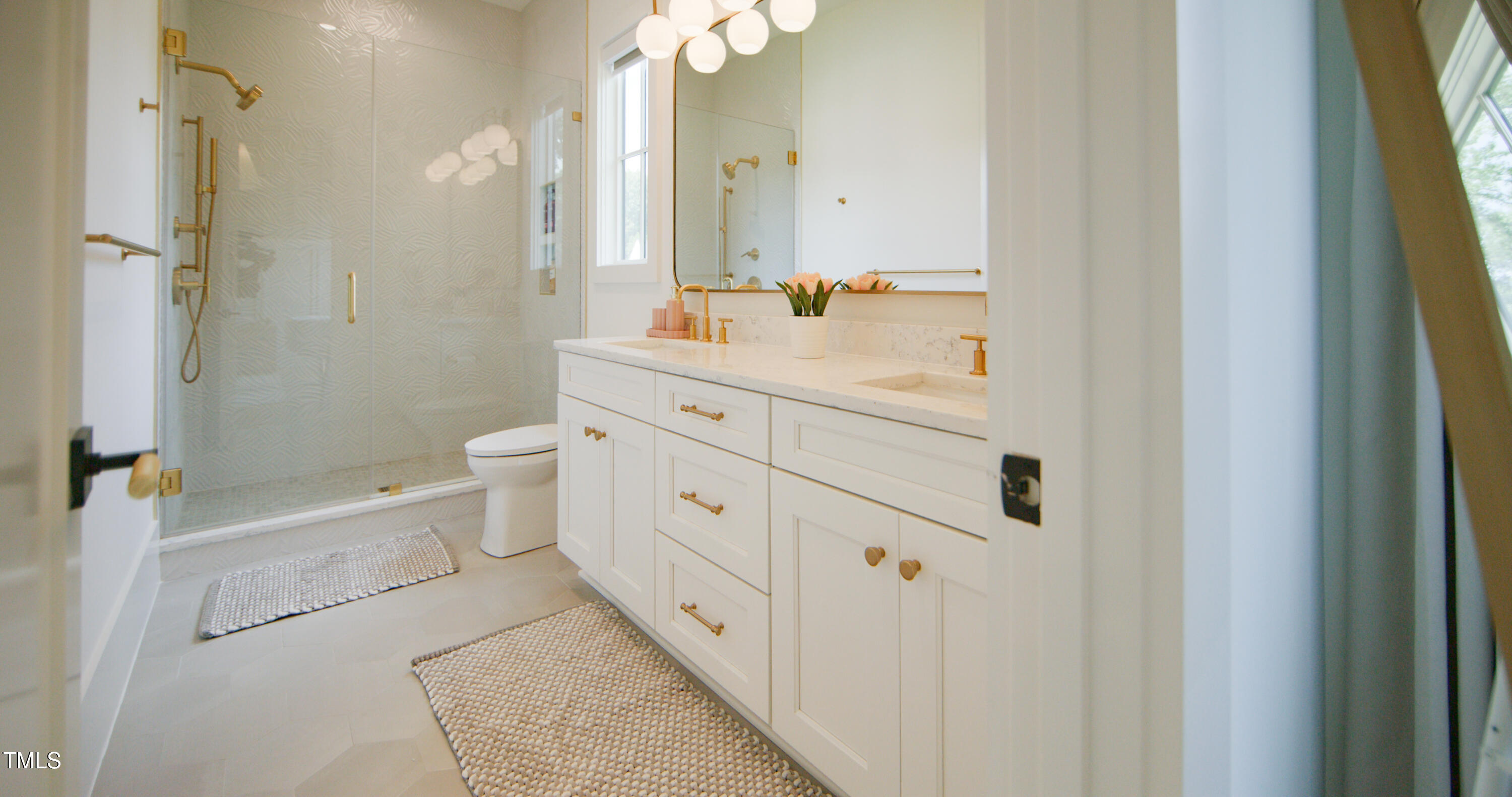 1620 Hunting Ridge Road Raleigh, NC 27615 - Photo 15 of 24 a bathroom with a double vanity sink toilet mirror and shower