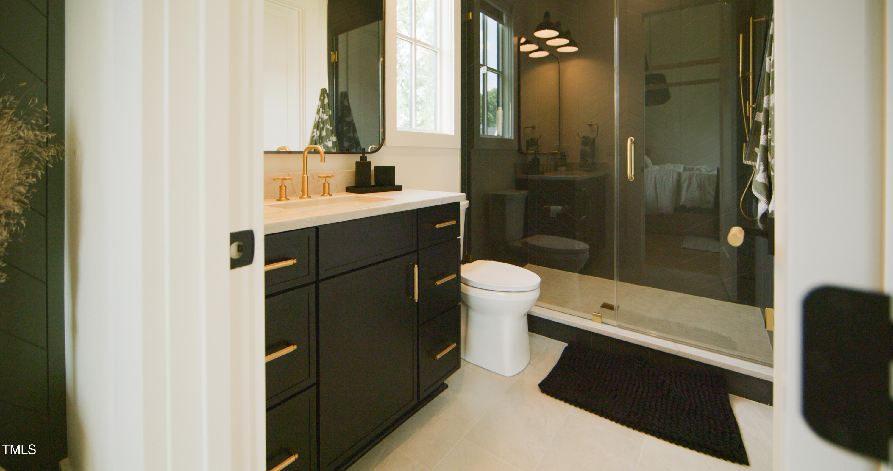 1620 Hunting Ridge Road Raleigh, NC 27615 - Photo 17 of 24 a bathroom with a sink a toilet and shower