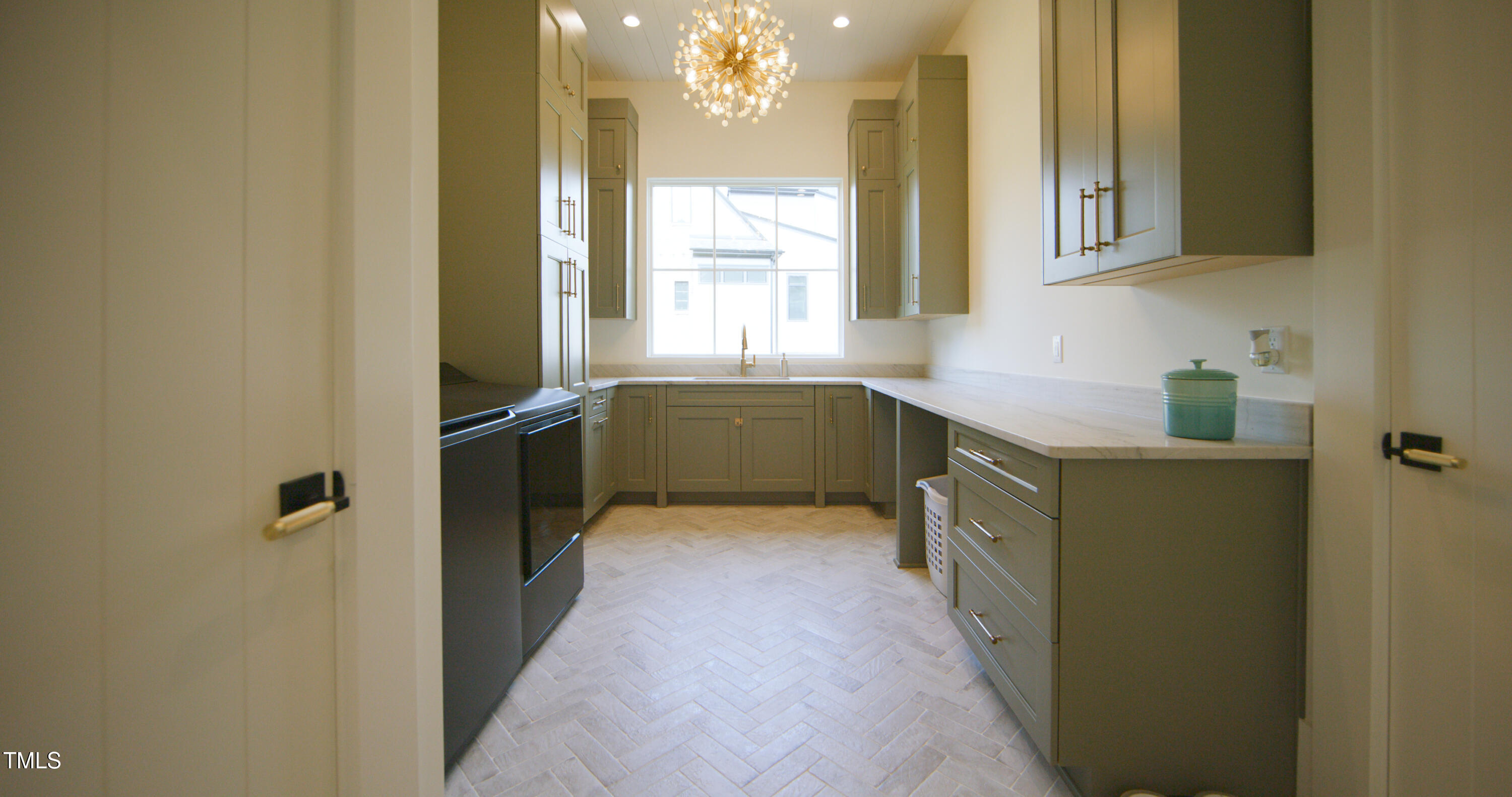 1620 Hunting Ridge Road Raleigh, NC 27615 - Photo 19 of 24 a kitchen with a sink and wooden cabinets