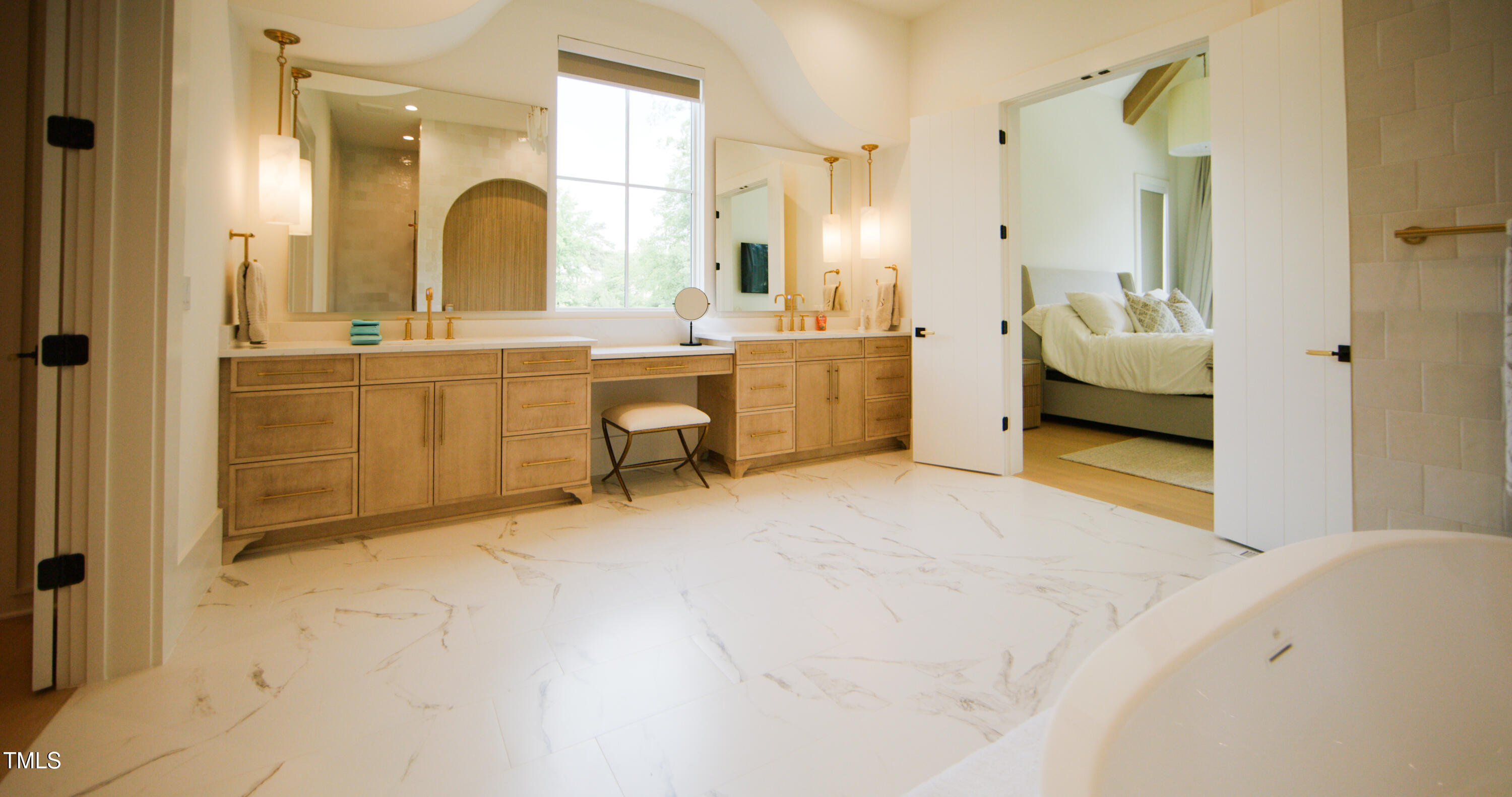 1620 Hunting Ridge Road Raleigh, NC 27615 - Photo 9 of 24 a en suite bathroom with a double vanity sink mirror and shower