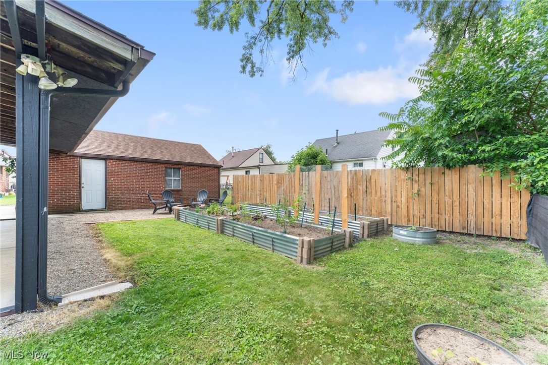 1515 Deville Avenue Northwest Canton, OH 44708 - Photo 38 of 42 Fenced backyard featuring a vegetable garden