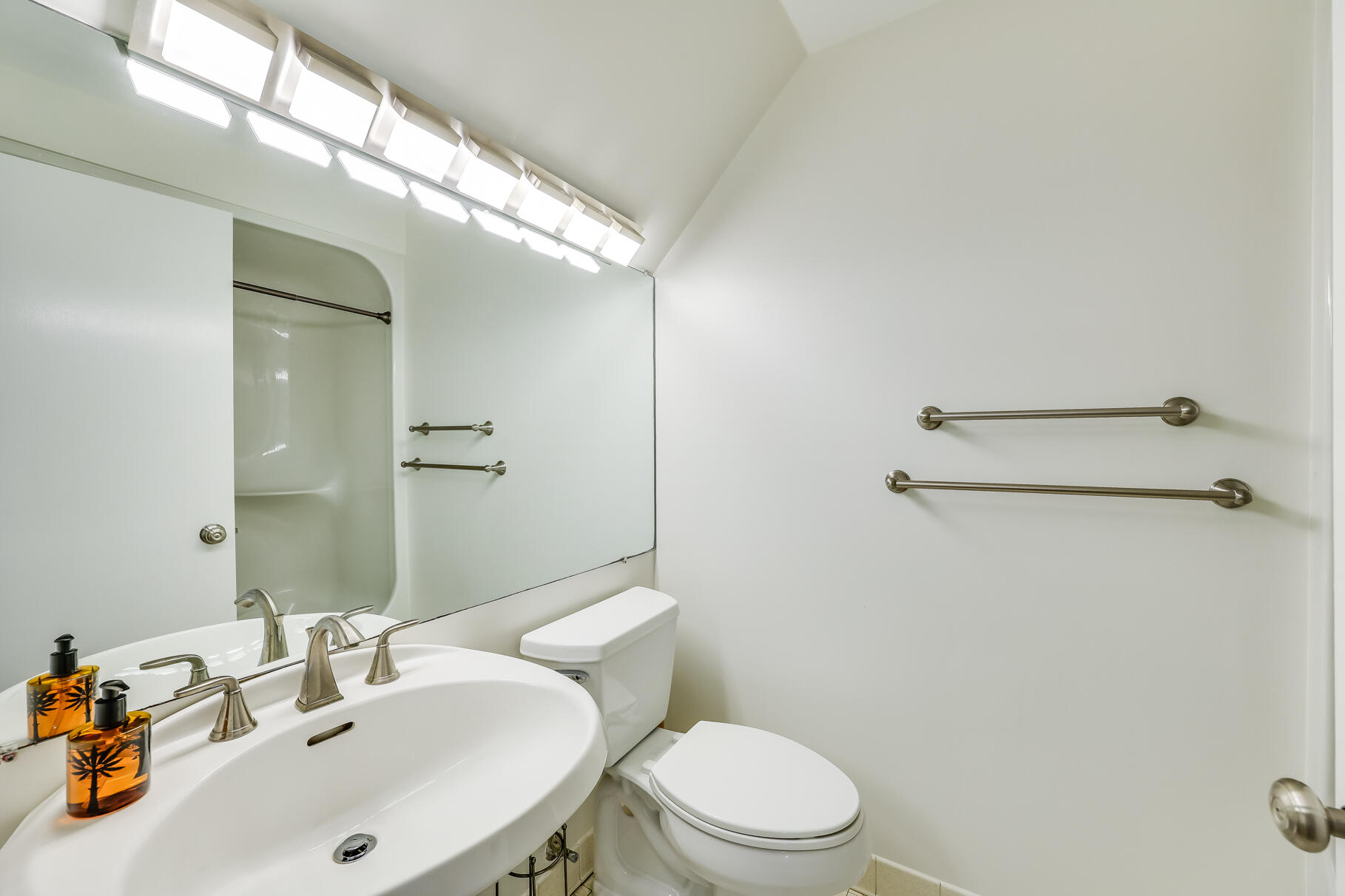 68 Mid-Iron Way, Unit 7545 Mashpee, MA 02649 - Photo 17 of 43 a bathroom with a sink mirror and toilet