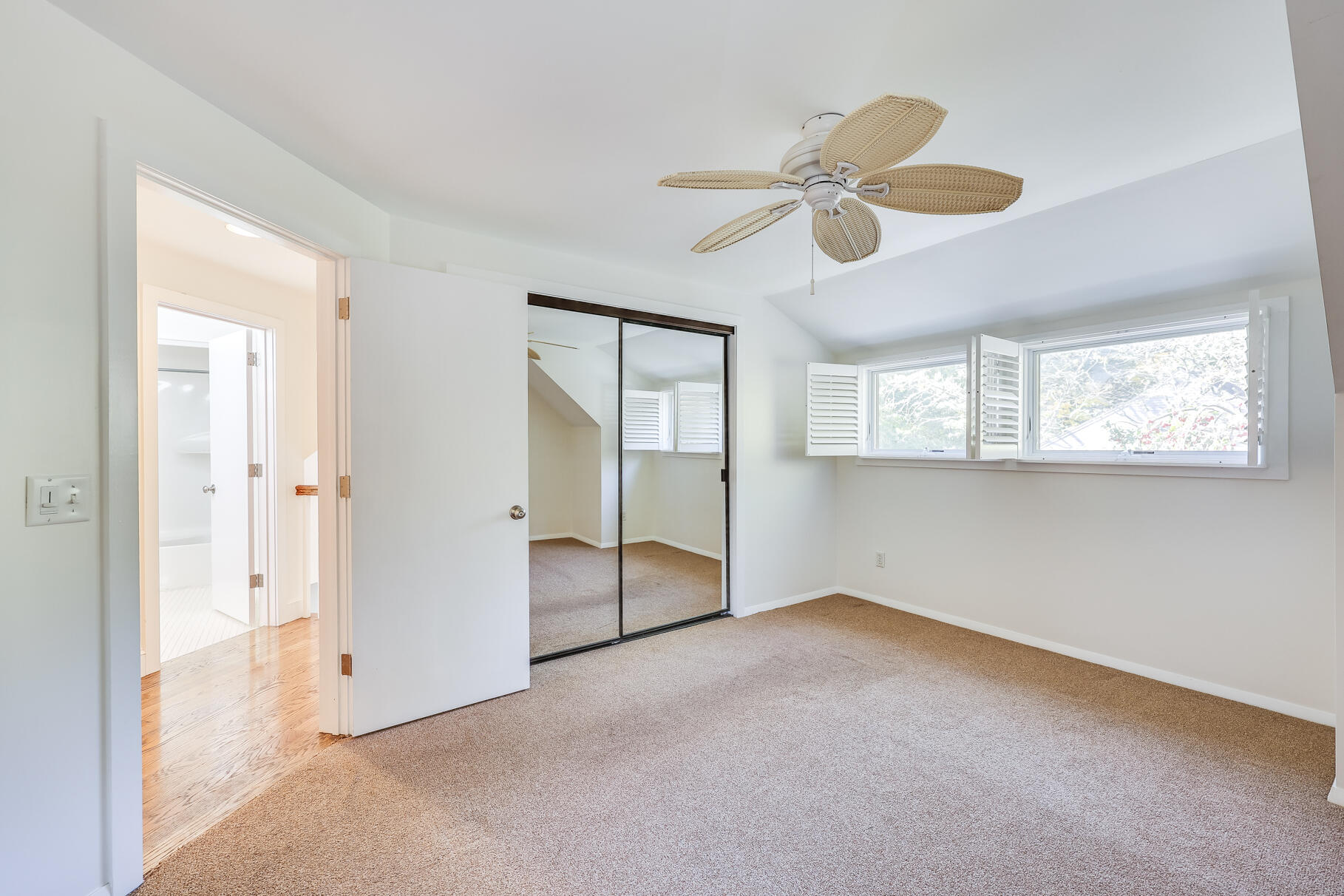68 Mid-Iron Way, Unit 7545 Mashpee, MA 02649 - Photo 21 of 43 an empty room with windows and fan