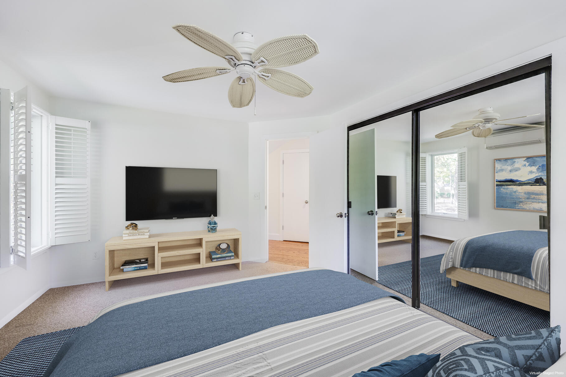 68 Mid-Iron Way, Unit 7545 Mashpee, MA 02649 - Photo 22 of 43 a bedroom with furniture and a flat screen tv