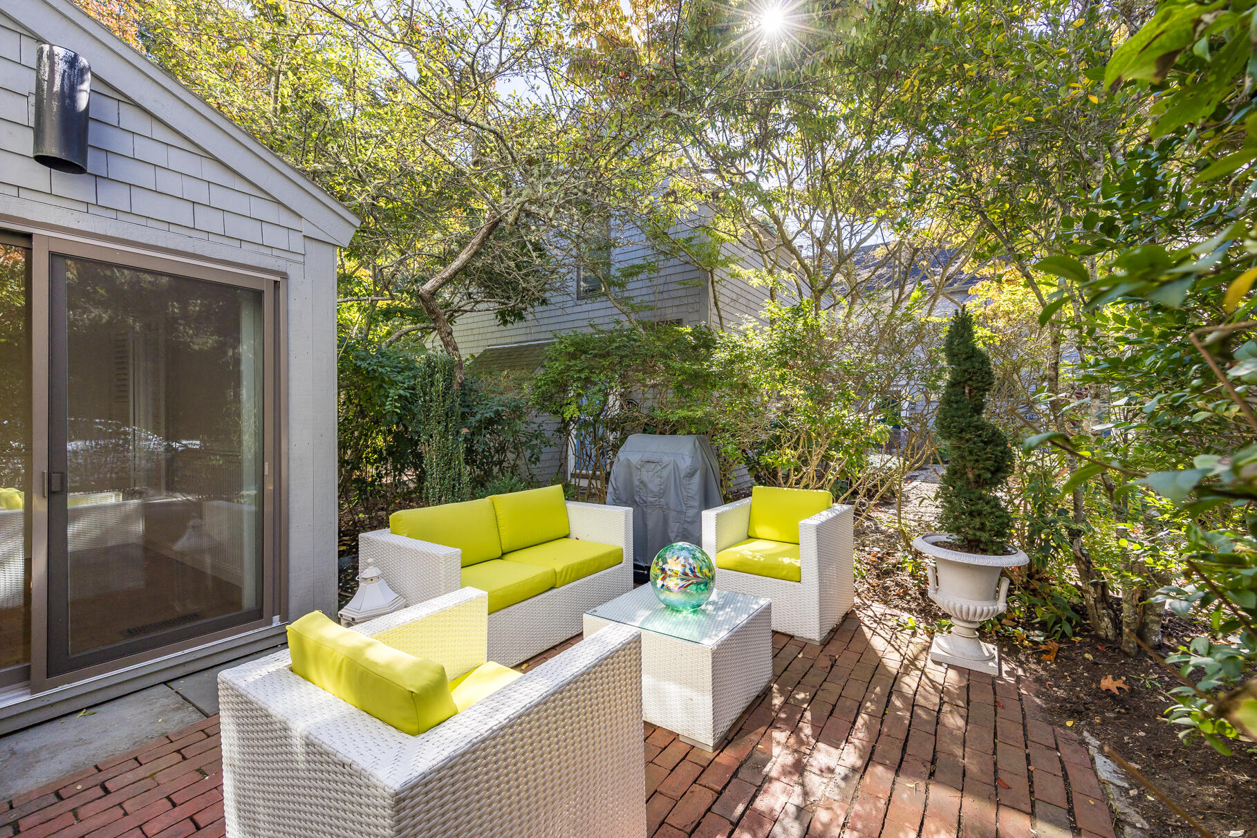 68 Mid-Iron Way, Unit 7545 Mashpee, MA 02649 - Photo 26 of 43 a view of backyard with swimming pool and sitting area