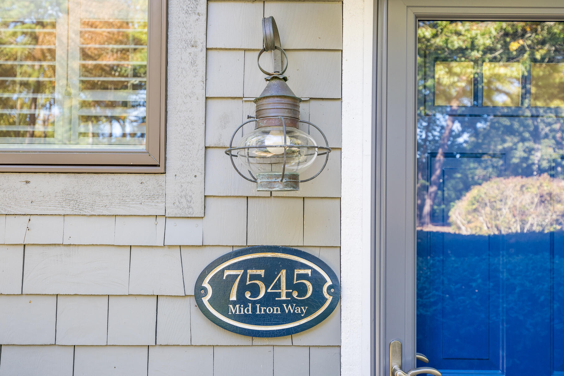 68 Mid-Iron Way, Unit 7545 Mashpee, MA 02649 - Photo 28 of 43 a front view of a door with wooden floor