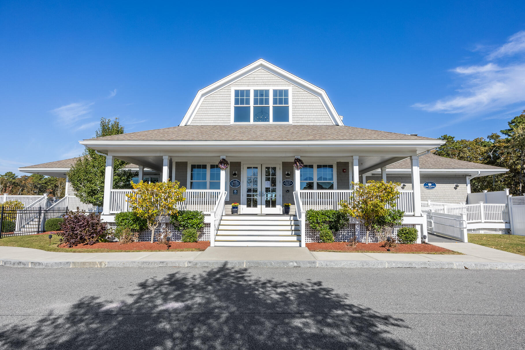 68 Mid-Iron Way, Unit 7545 Mashpee, MA 02649 - Photo 32 of 43 front view of a house with a yard