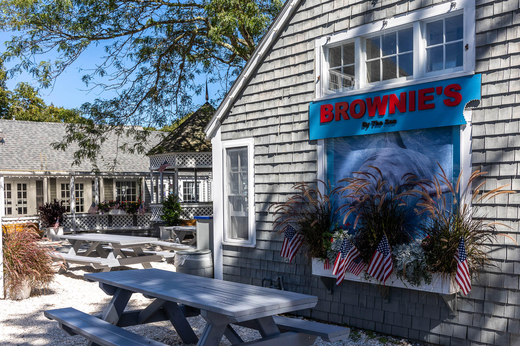 68 Mid-Iron Way, Unit 7545 Mashpee, MA 02649 - Photo 37 of 43 a view of a house with backyard and sitting area