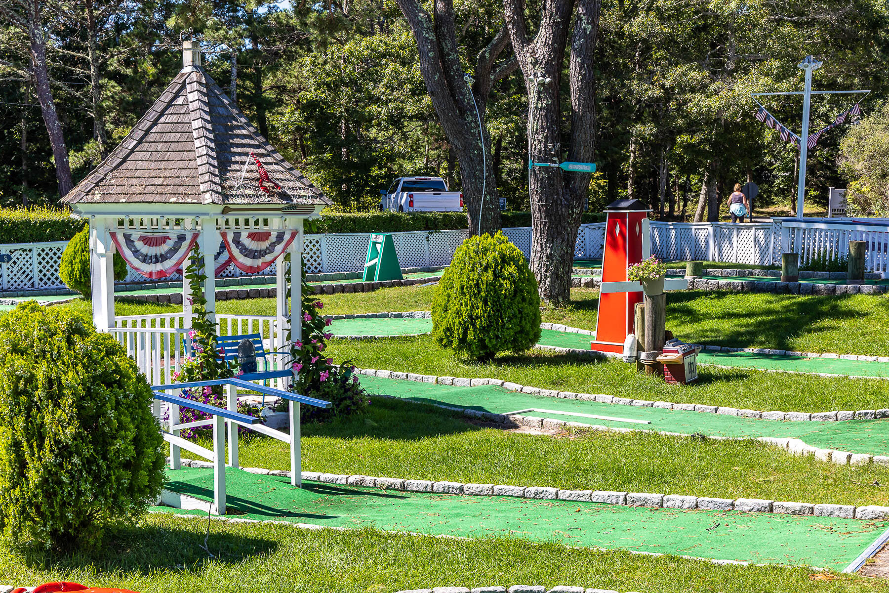 68 Mid-Iron Way, Unit 7545 Mashpee, MA 02649 - Photo 38 of 43 a childrens park with lots of swings and slides