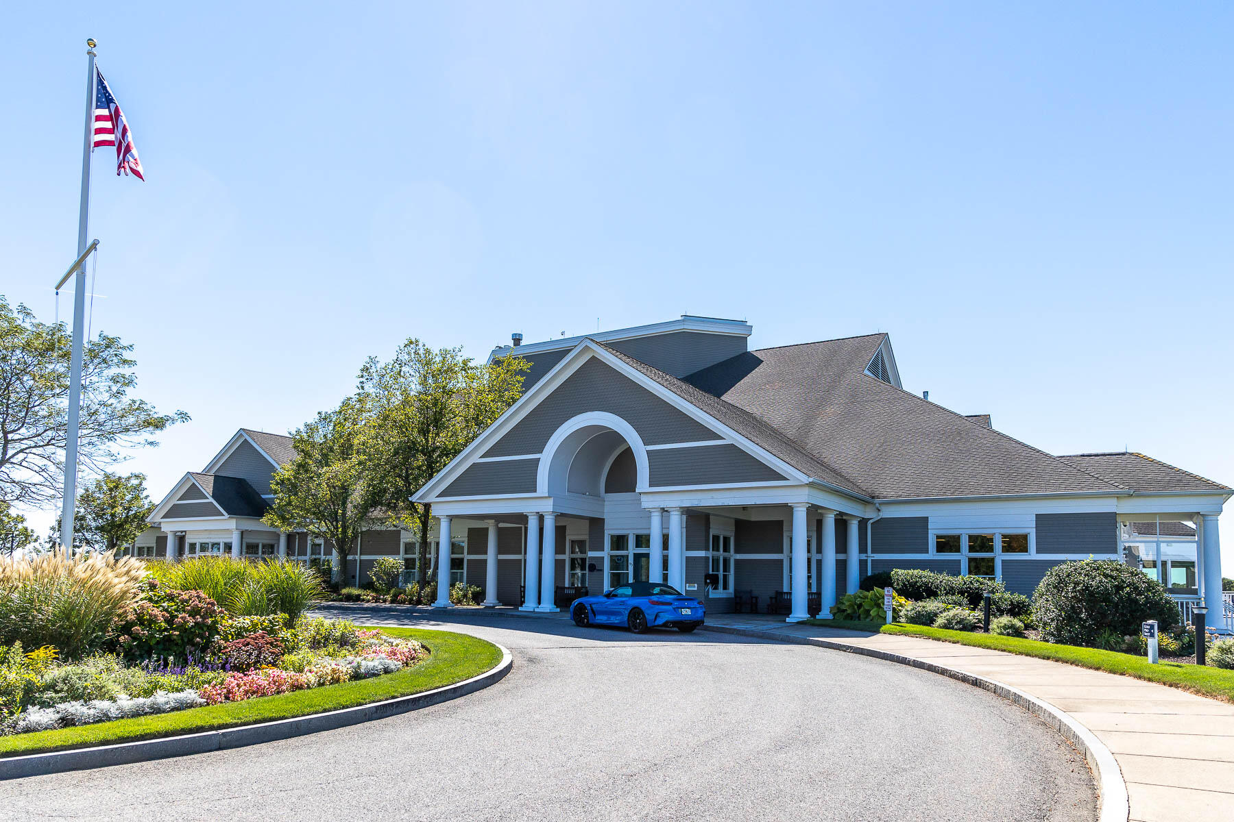 68 Mid-Iron Way, Unit 7545 Mashpee, MA 02649 - Photo 43 of 43 a front view of a house with a yard