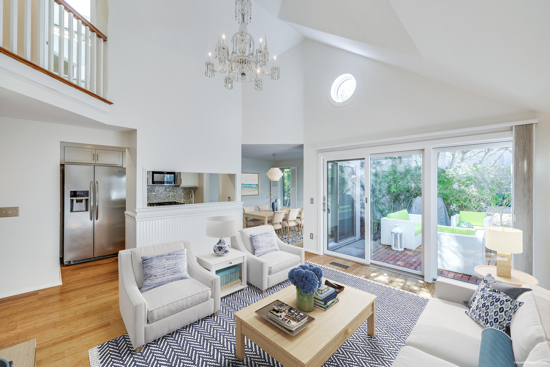 68 Mid-Iron Way, Unit 7545 Mashpee, MA 02649 - Photo 5 of 43 a living room with furniture a large window and a dining table