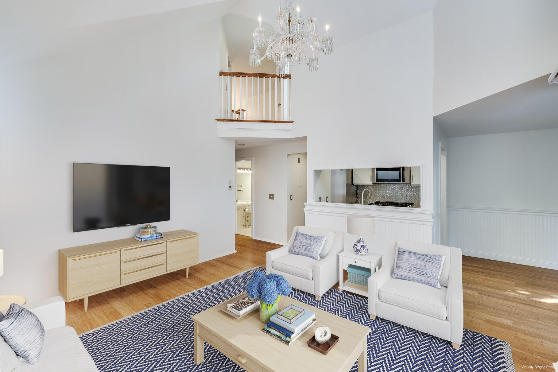 68 Mid-Iron Way, Unit 7545 Mashpee, MA 02649 - Photo 6 of 43 a living room with furniture and a flat screen tv